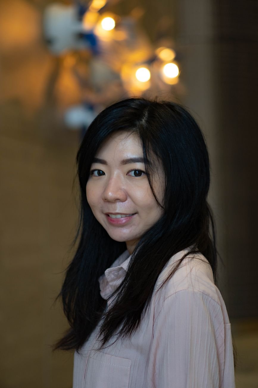 Portrait of a warm, smiling woman representing the attentive personal care Bloom brings to every family consultation